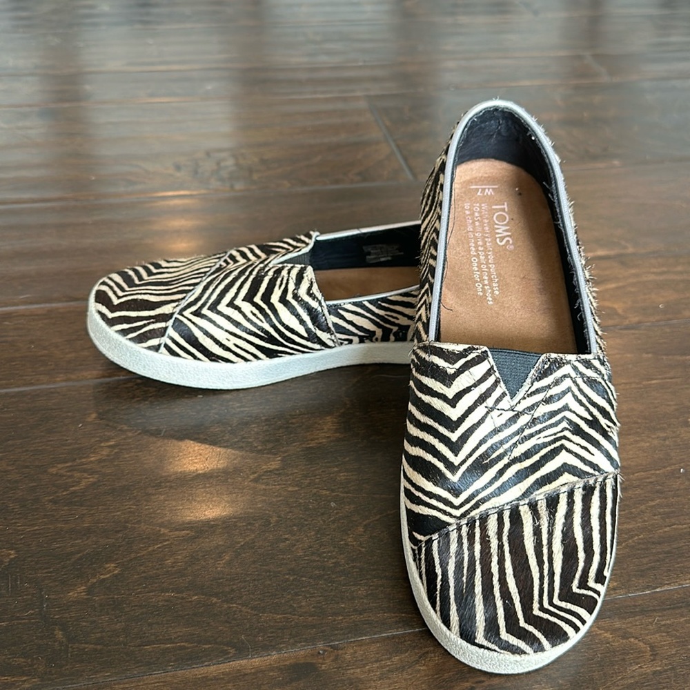 Toms zebra slip on shoes. Woman’s size 7